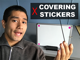 I should be aware of my hand gestures to make sure they don't cover up any stickers